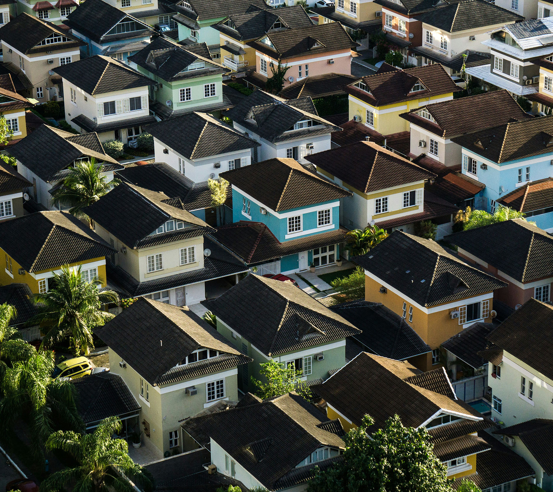 rows of colorful houses and their brown tiled roofs, Sheaff Brock investment advisors blog, retail consumers