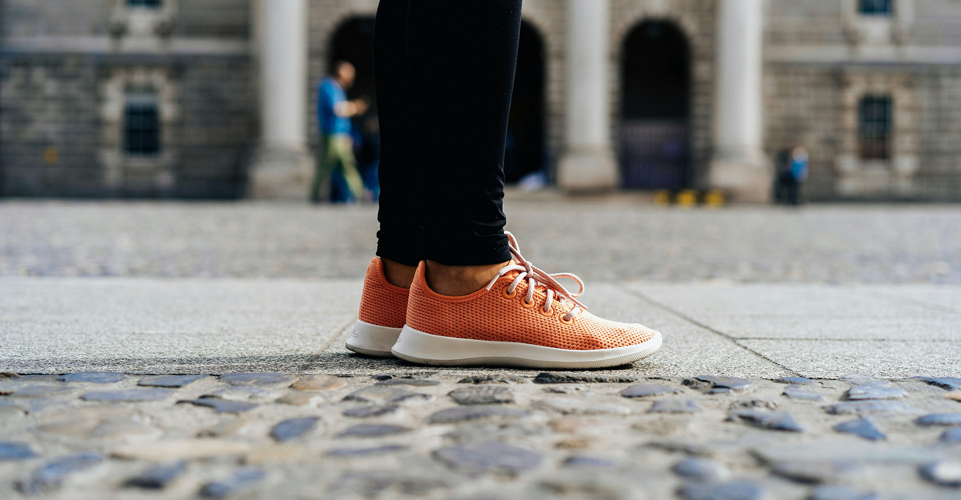 close-up of orange sneakers standing on the pavement pointed to the right of the image, Sheaff Brock investment advisors blog, retail consumers