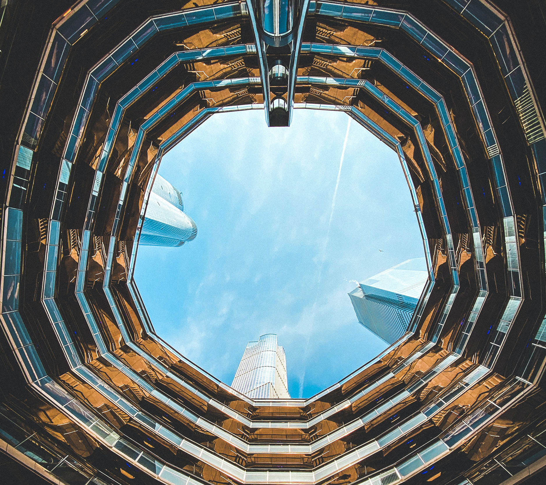 Sheaff Brock in the news, Dave Gilreath publications for Financial Advisor, view of inside of a courtyard looking up at the open sky with skyscrapers towering over the courtyard