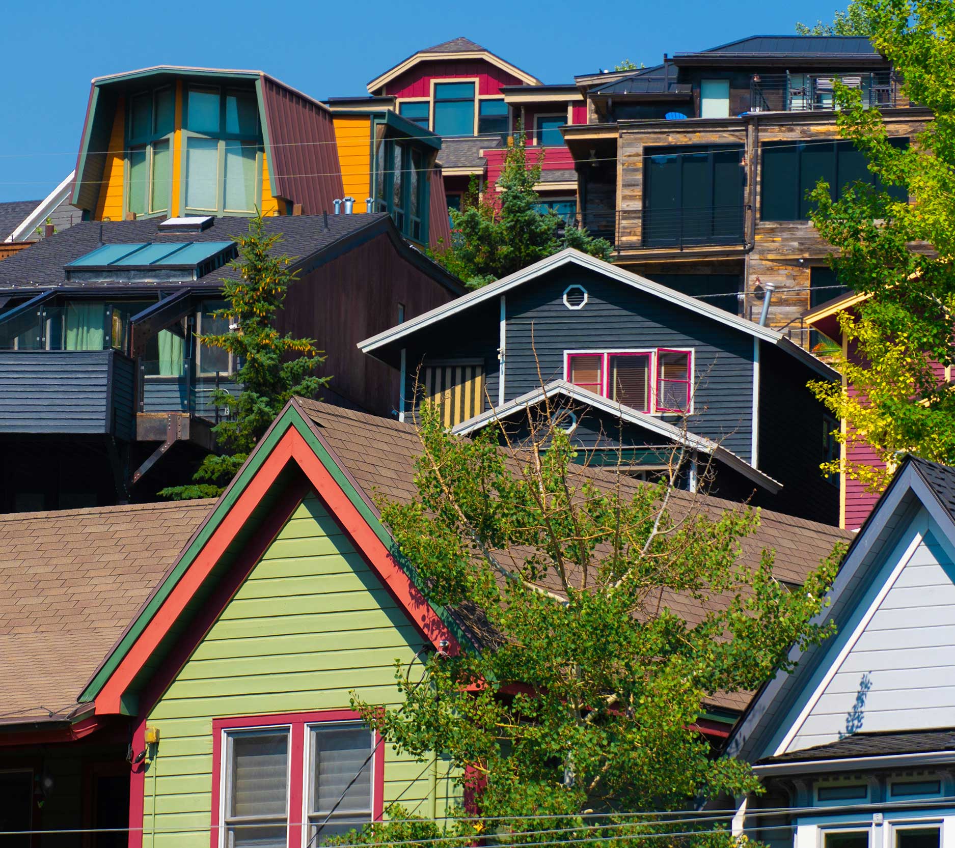 Sheaff Brock in the news, Tom Kaiser publications for Medical Economics, four rows of colorful homes on the side of a hill