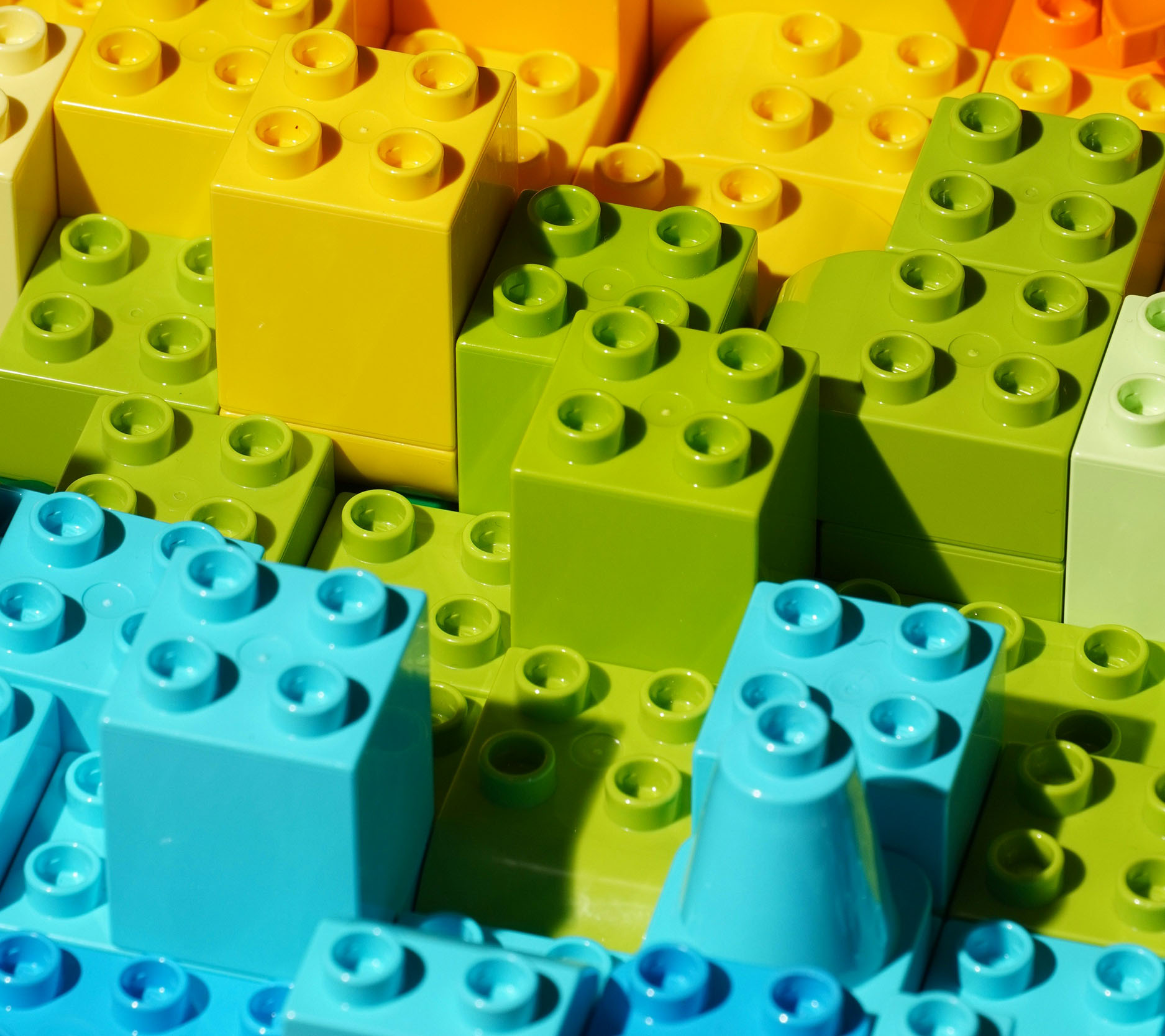 Sheaff Brock in the news, Dave Gilreath JR Humphreys publications for Medical Economics, close-up photo of brightly colored Legos stacked on top of each other