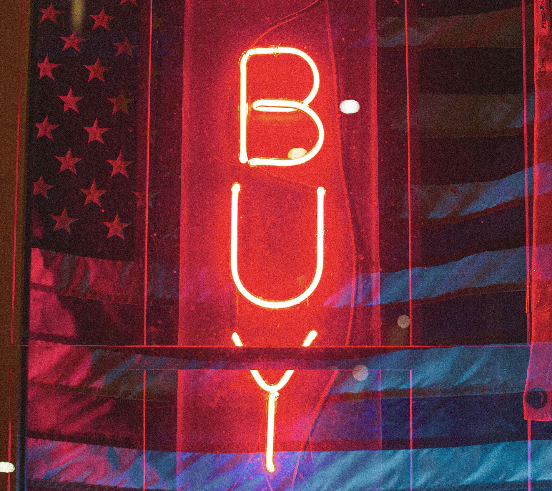 Sheaff Brock market update newsletters, March 2024, red neon sign that says "Buy" lit up in front of an American flag